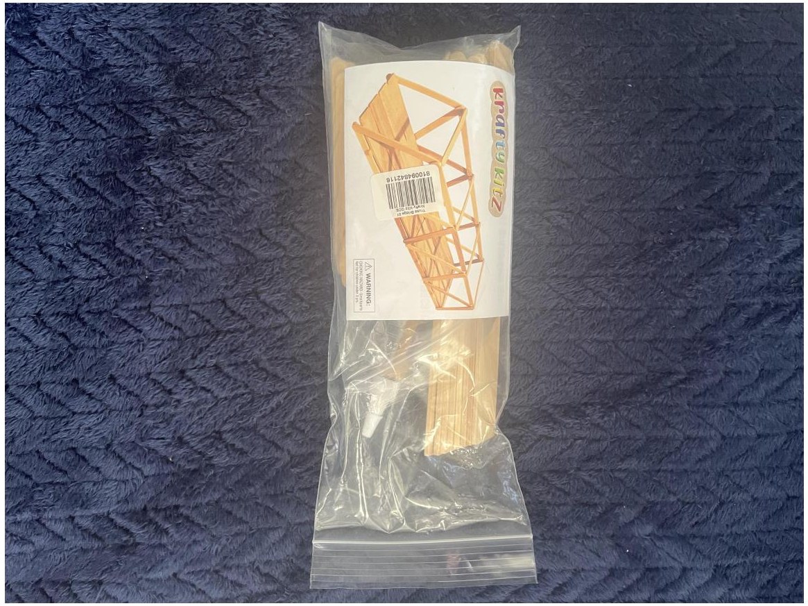 Wooden engineering activity packaged for a child